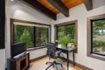 This home office features a modern desk and ergonomic chair, perfect for productive workdays.