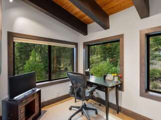 This home office features a modern desk and ergonomic chair, perfect for productive workdays.