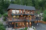 Experience luxury mountain living in this stunning multi-level home, nestled amidst a serene forest.