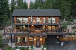Experience luxury mountain living in this stunning multi-level home, nestled amidst a serene forest landscape.