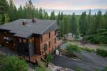 Experience luxury mountain living in this stunning modern home, nestled amidst towering pine trees with breathtaking lake and mountain views.