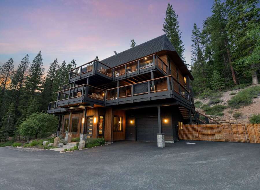 Experience luxury mountain living in this stunning multi-level home nestled among tall pine trees.