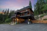 Experience luxury mountain living in this stunning multi-level home nestled among tall pine trees.