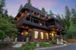 Experience luxury mountain living in this stunning multi-level home, featuring expansive decks perfect for enjoying the serene forest views.