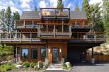 Experience modern mountain living in this stunning multi-level home, featuring expansive decks with breathtaking views and a sleek, contemporary design.