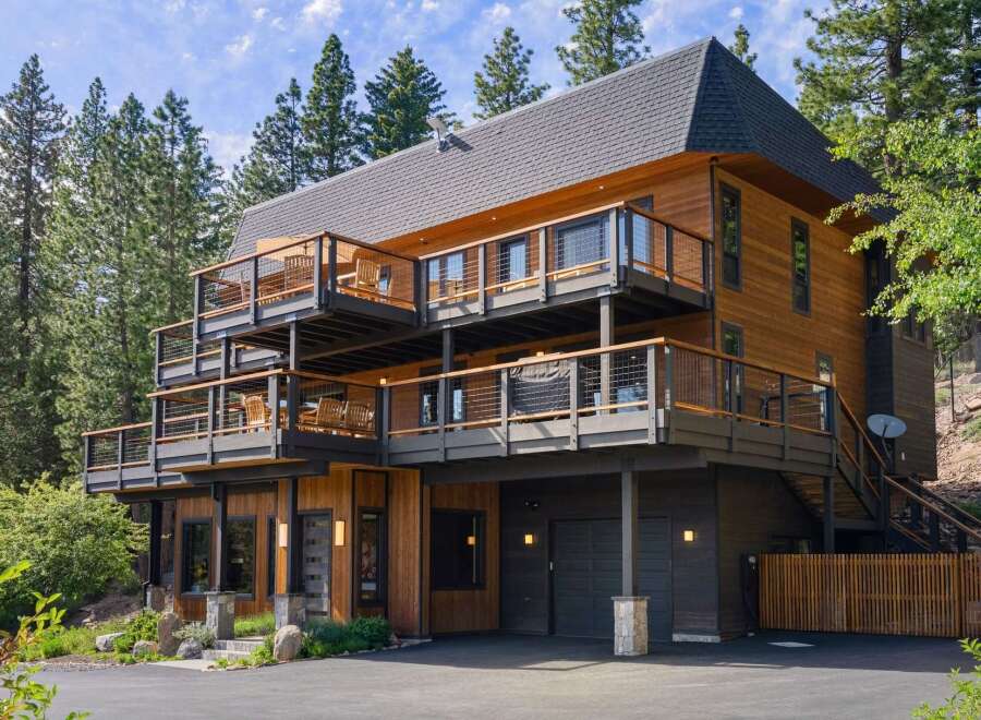 Experience luxury mountain living in this stunning multi-level home, nestled amidst towering pine trees.