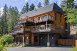 Experience luxury mountain living in this stunning multi-level home, nestled amidst towering pine trees.