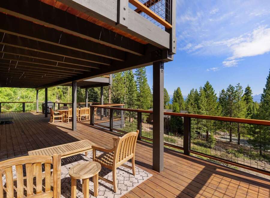 Experience breathtaking views from this expansive multi-level deck, perfect for entertaining or relaxing amidst nature.