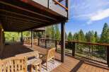 Experience breathtaking views from this expansive multi-level deck, perfect for entertaining or relaxing amidst nature.