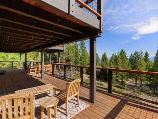 Experience breathtaking views from this expansive multi-level deck, perfect for entertaining or relaxing amidst nature.
