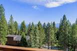 Experience breathtaking lake and mountain views from this stunning property nestled among tall pine trees.