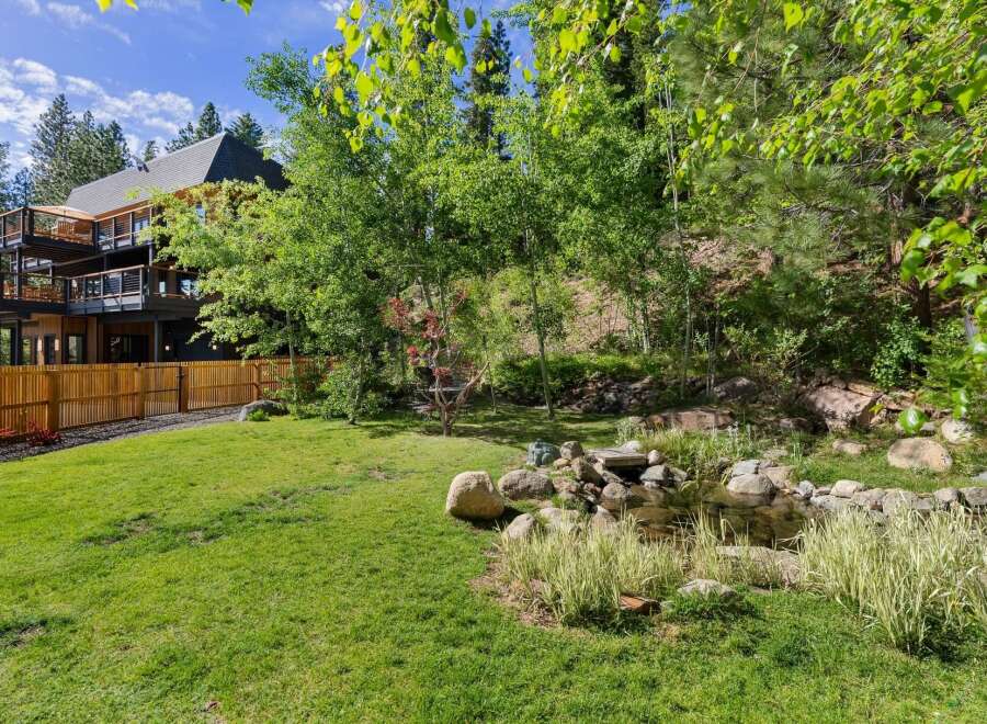 Experience luxury living in this stunning multi-level home, featuring expansive decks perfect for enjoying the surrounding natural beauty.