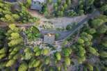 Discover this stunning property nestled amidst a lush pine forest, offering unparalleled privacy and natural beauty.