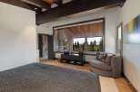 Experience luxurious living in this master bedroom, featuring a plush king-sized bed with a textured comforter.
