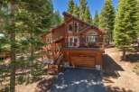 Nestled amidst towering pine trees, this stunning wooden mountain home offers a serene escape.