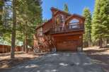 Experience mountain living in this stunning wooden home nestled amongst tall pine trees.