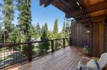 Enjoy breathtaking forest views from this expansive wooden deck, perfect for outdoor living and entertaining.