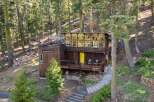 Nestled amidst a serene forest, this unique wooden cabin offers a tranquil retreat.