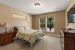 This inviting bedroom features a comfortable queen-size bed with plush bedding, perfect for a restful night's sleep.