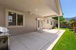 Enjoy outdoor living with this spacious covered patio, perfect for entertaining or relaxing.