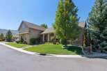 Discover this charming home featuring a beautifully manicured lawn and mature trees, perfect for outdoor enjoyment.