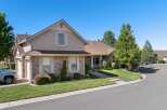 Discover this charming home featuring a beautiful stone facade and a well-maintained lawn.