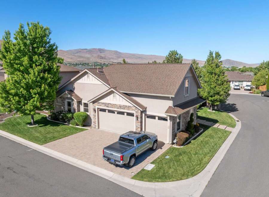 Discover this stunning home featuring a spacious three-car garage and a beautifully landscaped yard.