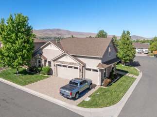 Discover this stunning home featuring a spacious three-car garage and a beautifully landscaped yard.
