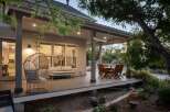 Enjoy outdoor living on this spacious covered deck, perfect for entertaining or relaxing.
