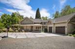Discover this stunning home featuring a welcoming covered porch and a spacious driveway with a basketball hoop.
