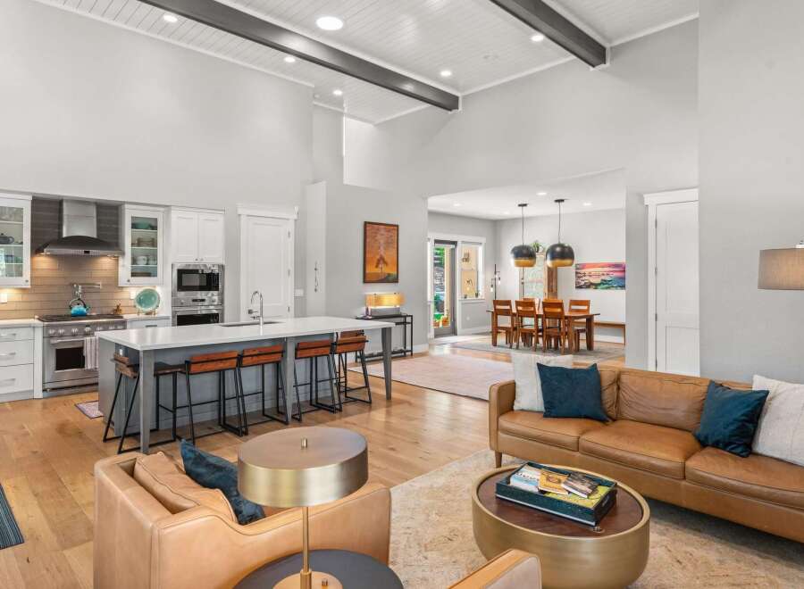 Experience open-concept living in this stunning home, featuring a gourmet kitchen with a large island and bar seating, perfect for entertaining.