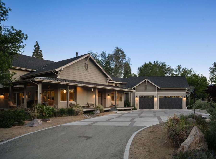 This charming home features a welcoming wrap-around porch perfect for enjoying the serene surroundings.