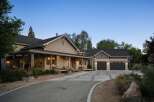 This charming home features a welcoming wrap-around porch perfect for enjoying the serene surroundings.