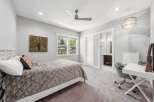 This inviting bedroom features a comfortable bed with a plush comforter and decorative pillows, perfect for relaxation.