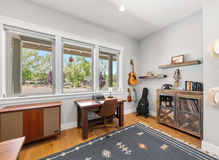 This charming home office features a vintage typewriter on a wooden desk, perfect for creative work.