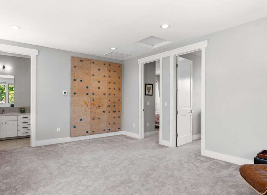 This spacious room features a unique climbing wall, perfect for active individuals or families.