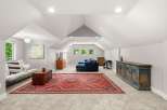 Discover this spacious and inviting bonus room, perfect for a home theater, playroom, or additional living space.
