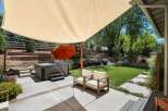 Enjoy ultimate relaxation in this backyard oasis, featuring a luxurious hot tub perfect for unwinding.
