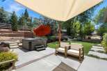 Enjoy ultimate relaxation in this backyard oasis, featuring a luxurious hot tub perfect for unwinding.