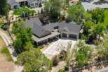 Discover this stunning property featuring a spacious main house with a welcoming covered porch and a detached garage.