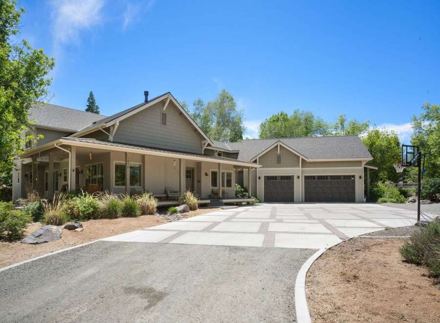 Discover this stunning home featuring a spacious covered porch perfect for relaxing evenings.
