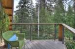 Enjoy the serene mountain views from this charming deck, perfect for morning coffee or evening relaxation.