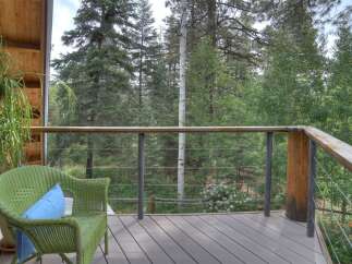 Enjoy the serene mountain views from this charming deck, perfect for morning coffee or evening relaxation.