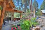 Enjoy outdoor living with this charming property featuring a covered patio, a relaxing hot tub, and a beautifully landscaped garden.