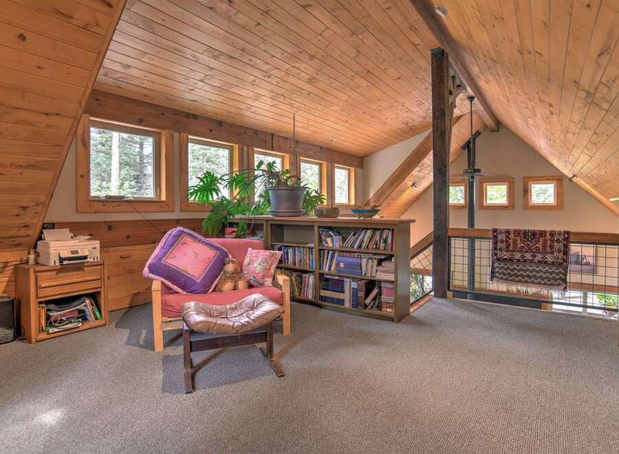 Discover this charming attic loft space, perfect for a cozy reading nook or home office.