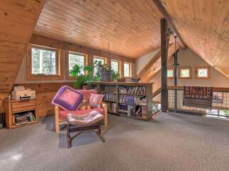 Discover this charming attic loft space, perfect for a cozy reading nook or home office.