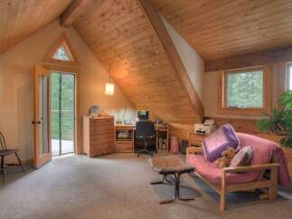 Discover this charming attic room, perfect for a home office or cozy retreat.