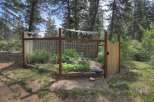 Discover a charming fenced garden, perfect for cultivating your own vegetables and herbs.