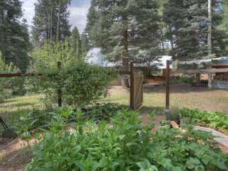 Discover a charming rural retreat with a thriving garden, perfect for those who love to cultivate their own produce.