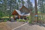 Escape to this charming cabin nestled amongst tall pine trees, offering a serene retreat.